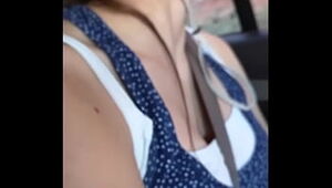 Tight tank top on teen up close in car
